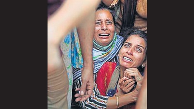 Deepak Chand Mehra’s wife moments before his cremation in Jammu on Friday. (AP) Deepak Chand Mehra’s wife moments before his cremation in Jammu on Friday. (AP)