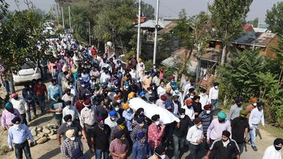 People carry the mortal remains of government school principal Satinder Kour in Srinagar on Friday. (HT photo/Waseem Andrabi) People carry the mortal remains of government school principal Satinder Kour in Srinagar on Friday. (HT photo/Waseem Andrabi)