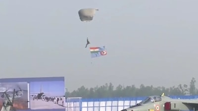 One of the three paratroopers is seen landing at the Hindon Air Force base during 89th IAF Day celebrations. (ANI Photo) One of the three paratroopers is seen landing at the Hindon Air Force base during 89th IAF Day celebrations. (ANI Photo)
