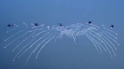 Indian Air Force (IAF) Apache helicopters fire flares during the Air Force Day Parade at Hindon Air Force Station in Ghaziabad, Uttar Pradesh. (Bloomberg) Indian Air Force (IAF) Apache helicopters fire flares during the Air Force Day Parade at Hindon Air Force Station in Ghaziabad, Uttar Pradesh. (Bloomberg)