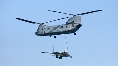 An Indian Air Force (IAF) Chinook helicopter carries an artillery gun during the Air Force Day Parade at Hindon Air Force Station in Ghaziabad, Uttar Pradesh on October 8. (Bloomberg) An Indian Air Force (IAF) Chinook helicopter carries an artillery gun during the Air Force Day Parade at Hindon Air Force Station in Ghaziabad, Uttar Pradesh on October 8. (Bloomberg)