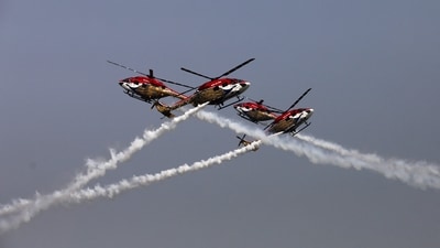 Indian Air Force (IAF) Advanced Light Helicopter (ALH) 'Sarang' team performs during the 89th Air Force Day parade, at Hindon Air Force Station in Ghaziabad. (REUTERS)