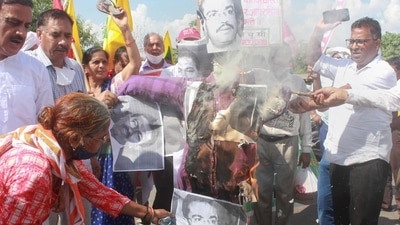 Samyukt Kisan Morcha and various social activists burn effigy of Union minister of state for home Ajay Kumar Mishra Teni, his son Ashish Mishra as they protest over the Lakhimpur Kheri incident. (PTI) Samyukt Kisan Morcha and various social activists burn effigy of Union minister of state for home Ajay Kumar Mishra Teni, his son Ashish Mishra as they protest over the Lakhimpur Kheri incident. (PTI)