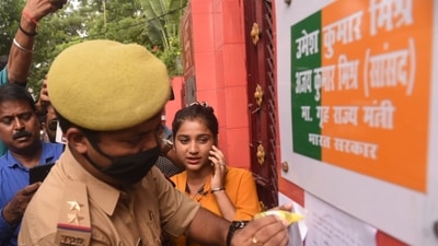A police personnel pastes a notice outside Union minister Ajay Mishra's residence on Friday. (Deepak Gupta/HT Photo) A police personnel pastes a notice outside Union minister Ajay Mishra's residence on Friday. (Deepak Gupta/HT Photo)