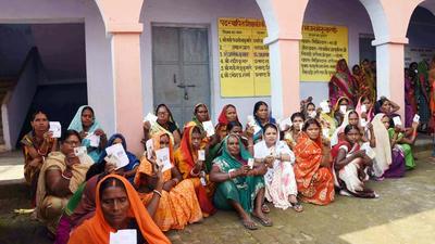 Women voters show their ID cards during the third phase of the Bihar Panchayat Elections 2021, at Naubatpur in Patna on Friday. (ANI) Women voters show their ID cards during the third phase of the Bihar Panchayat Elections 2021, at Naubatpur in Patna on Friday. (ANI)