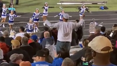 The dad performs the entire routine along with cheerleaders. (Twitter/@MartyOBrienDP)