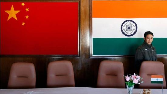 A man walks inside a conference room used for meetings between military commanders of China and India, at the Indian side of the Indo-China border at Bumla, in the northeastern state of Arunachal Pradesh, in this file photo. (REUTERS)