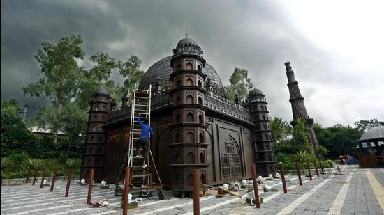 A worker prepares a replica of India's monuments made from scrap at Bharat Darshan Park located at Punjabi Bagh in New Delhi. (ANI)