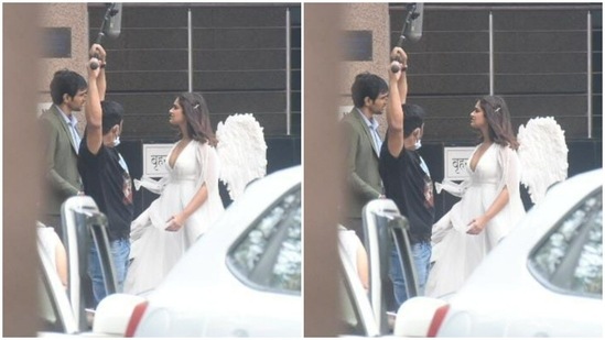 In the pictures clicked by paparazzi, Ileana can be seen engrossed in giving her shots, while looking elegant in a long spotless white dress.(HT Photos/Varinder Chawla)