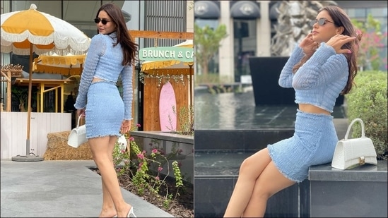 Television sensation Aamna Sharif's latest pictures from Dubai, in a bold fashion and shorter hemline, serves millennial fashion inspiration as the actor looked bold and edgy in a pastel blue crop top and a high-waist mini skirt.(Instagram/aamnasharifofficial)