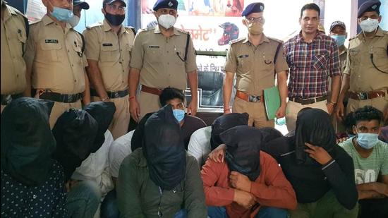 Nainital police with the nine men accused of betting on IPL matches. (HT PHOTO.)