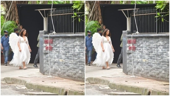 Ileana was seen walking down the pavement as she gave her shot in angelic wings, the long white dress and straight shoulder-length tresses left open.(HT Photos/Varinder Chawla)