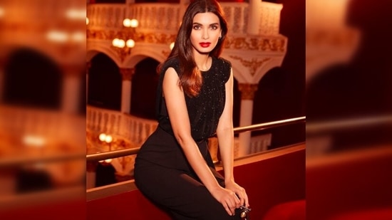 For her third evening look, Diana Penty opted for a classic black blouse and high-rise trousers.(Instagram/@dianapenty)