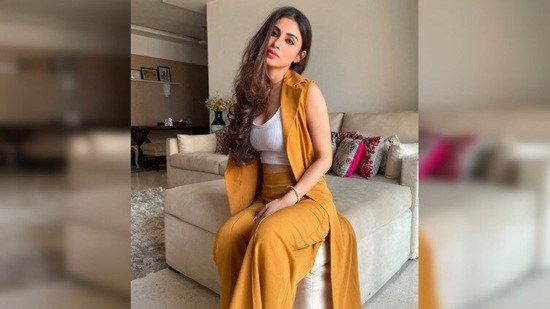 Mouni Roy looks stunning as she poses for the camera on a comfy couch.(Instagram/@imouniroy)