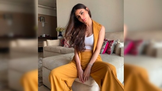 Mouni Roy keeps it comfy yet stylish in yellow trousers and a cape.(Instagram/@imouniroy)