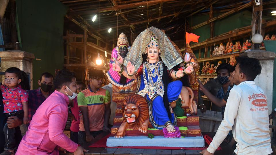 Mumbai, India - October 07, 2021: Devotees take the idol of Devi Dashama, which will be worshipped for the next 9 days during the Navratri festival, at Andheri, in Mumbai, India, on Thursday, October 07, 2021. (Photo by Vijay Bate/HT Photo) Mumbai, India - October 07, 2021: Devotees take the idol of Devi Dashama, which will be worshipped for the next 9 days during the Navratri festival, at Andheri, in Mumbai, India, on Thursday, October 07, 2021. (Photo by Vijay Bate/HT Photo) 