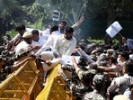 Youth Congress supporters climb over police barricades during a protest over the Lakhimpur Kheri incident near Union Home Minister's residence, in New Delhi on Saturday. (ANI) Youth Congress supporters climb over police barricades during a protest over the Lakhimpur Kheri incident near Union Home Minister's residence, in New Delhi on Saturday. (ANI)