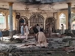 People view the damage inside of a mosque following a bombing in Kunduz, province northern Afghanistan, on Friday, October. 8, 2021. (AP) People view the damage inside of a mosque following a bombing in Kunduz, province northern Afghanistan, on Friday, October. 8, 2021. (AP)