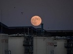The moon rises behind the storage tanks of a local oil refinery in Omsk, Russia June 5, 2020 (REUTERS/Alexey Malgavko/File Photo) The moon rises behind the storage tanks of a local oil refinery in Omsk, Russia June 5, 2020 (REUTERS/Alexey Malgavko/File Photo)