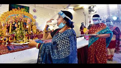 Durga Puja organisers in the Capital ensure Covid-19 safety protocols by delivering pre-booked bhog, restricted entry and live-stream pujo celebrations. Durga Puja organisers in the Capital ensure Covid-19 safety protocols by delivering pre-booked bhog, restricted entry and live-stream pujo celebrations.