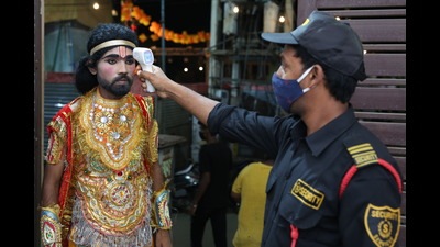 Before his entry, actor Umesh Prajapat, who plays Sumant, gets his temperature checked at Shri Durga Ramlila in Jacobpura, Gurugram. (Photo: Manoj Verma/HT) Before his entry, actor Umesh Prajapat, who plays Sumant, gets his temperature checked at Shri Durga Ramlila in Jacobpura, Gurugram. (Photo: Manoj Verma/HT)