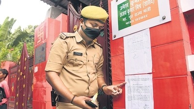 A policeman pastes a notice outside the residence of Union minister of state Ajay Mishra ‘Teni’ summoning his son Ashish Mishra for questioning in connection with the Lakhimpur Kheri violence case. (File Photo / HT) A policeman pastes a notice outside the residence of Union minister of state Ajay Mishra ‘Teni’ summoning his son Ashish Mishra for questioning in connection with the Lakhimpur Kheri violence case. (File Photo / HT)