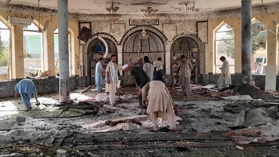 People view the damage inside of a mosque following a bombing in Kunduz, province northern Afghanistan, on Friday, October. 8, 2021. (AP) People view the damage inside of a mosque following a bombing in Kunduz, province northern Afghanistan, on Friday, October. 8, 2021. (AP)