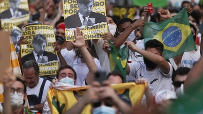 People attend a protest to demand the impeachment of Brazil's President Jair Bolsonaro and against his handling of the Covid-19 pandemic, at Paulista Avenue in Sao Paulo. (REUTERS)