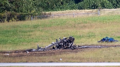 Emergency Response teams work the scene of a fatal small plane crash at DeKalb-Peachtree Airport, Georgia on Friday, Oct. 8, 2021, (Alyssa Pointer/Atlanta Journal-Constitution via AP)