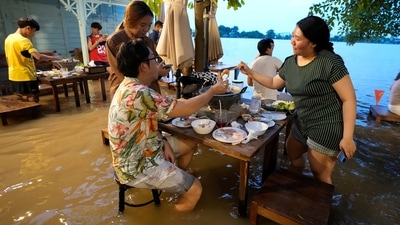Flood dining at a riverside restaurant becomes a hit among tourists in Thailand (AP) Flood dining at a riverside restaurant becomes a hit among tourists in Thailand (AP)