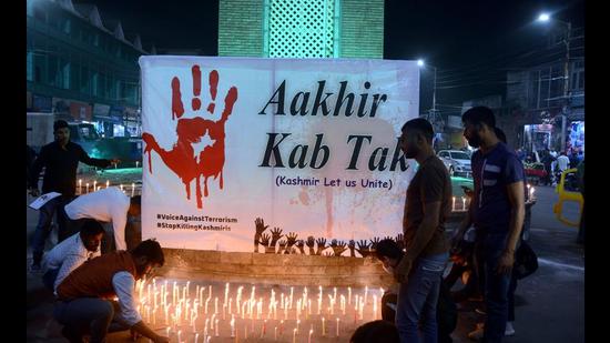 Kashmiri Pandits take part in a candle light protest against the killing of three persons, October 6, 2021 (PTI) Kashmiri Pandits take part in a candle light protest against the killing of three persons, October 6, 2021 (PTI)