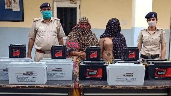The accused women and the stolen batteries of CCTV cameras in the custody of Chandigarh Police on Saturday. (HT Photo)