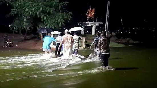 A man fell in a drainage along with his bike at Chintalkunta late on Friday night and rescue and relief personnel made efforts to trace him. The man, however, reached home safely, official sources said.(ANI)