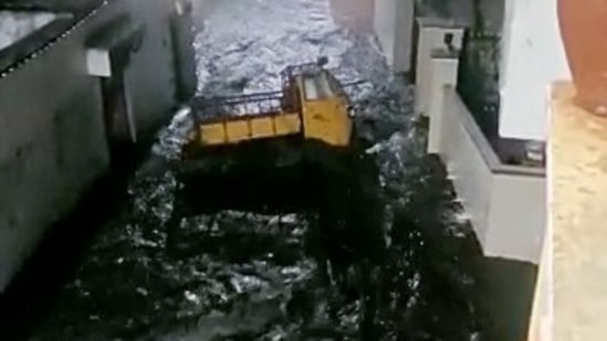 A vehicle washes away with the waterlogged street after the heavy rains lashes in many parts of the city, in Hyderabad on October 9.(ANI)
