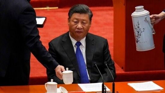 Hostesses refill tea for Chinese President Xi Jinping during an event commemorating the 110th anniversary of the Xinhai Revolution at the Great Hall of the People in Beijing on Saturday. (AP) Hostesses refill tea for Chinese President Xi Jinping during an event commemorating the 110th anniversary of the Xinhai Revolution at the Great Hall of the People in Beijing on Saturday. (AP)