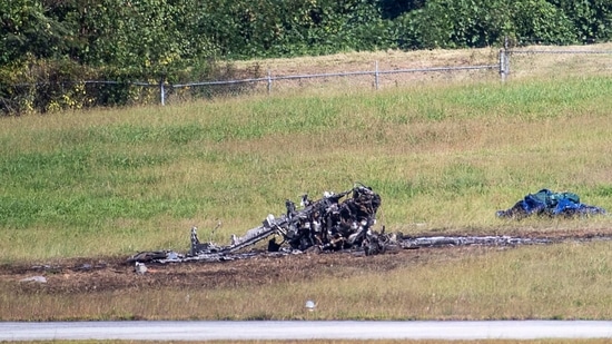 Emergency Response teams work the scene of a fatal small plane crash at DeKalb-Peachtree Airport, Georgia on Friday, Oct. 8, 2021,(Alyssa Pointer/Atlanta Journal-Constitution via AP)