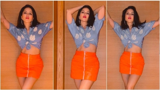Sunny Leone, who never fails to impress the fashion police with her sartorial choices, shared a few photos of herself in a cropped blue shirt and an orange skirt.(Instagram/@sunnyleone)