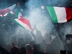 People wave national flags during a protest against the mandatory sanitary pass called “green pass” with the aim to limit the spread of the Covid-19 in central Rome on October 9, 2021. People wave national flags during a protest against the mandatory sanitary pass called “green pass” with the aim to limit the spread of the Covid-19 in central Rome on October 9, 2021. 