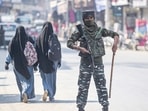 A security personnel stands guard during a surprise checking in Srinagar, Saturday, Oct. 9, 2021. Srinagar city has been put on a high alert following the recent several civilian killings. (PTI Photo/S. Irfan)(PTI) A security personnel stands guard during a surprise checking in Srinagar, Saturday, Oct. 9, 2021. Srinagar city has been put on a high alert following the recent several civilian killings. (PTI Photo/S. Irfan)(PTI)
