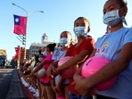 Girls hold balls and they rehearsal ahead of the national day celebration in front of the presidential office in Taipei, Taiwan, October 10, 2021.&nbsp;