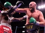 Tyson Fury (R) and Deontay Wilder exchange punches. (Getty) Tyson Fury (R) and Deontay Wilder exchange punches. (Getty)
