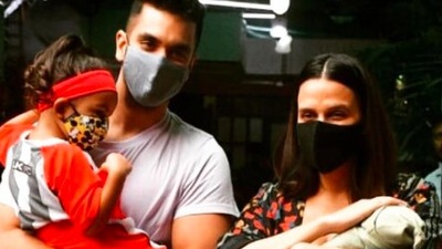 Neha Dhupia and Angad Bedi pose with their two children Mehr Angad Dhupia and the newborn. (Instagram/@nehadhupia)