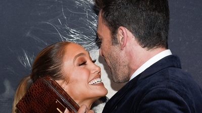 Jennifer Lopez, dressed in a shimmery two piece, and Ben Affleck, decked up in a suit, were inseparable at the premiere of The Last Duel. (Photo by Evan Agostini/Invision/AP) (Evan Agostini/Invision/AP)