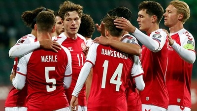 Denmark's defender Joakim Maehle celebrates with teammates after scoring the team's fourth goal. (Getty)