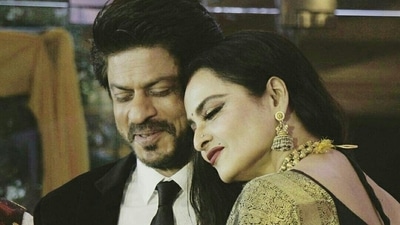 Shah Rukh Khan and Rekha at an event. Shah Rukh Khan and Rekha at an event.