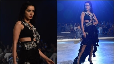 Shraddha completed the outfit with sleek black pointed stilettos and floral shaped drop earrings. She left her locks open and parted in the middle, styling them in a wet-hair look. Smoky eye shadow, glowing skin, nude pink lip shade, and kohl-lined eyes completed Shraddha's beauty picks for the ensemble. (HT Photo/Varinder Chawla)