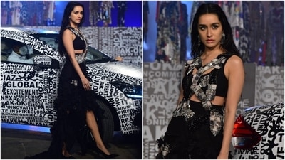 Shraddha closed day 4 of the FDCI x Lakme Fashion Week as she walked for the ace designer. She wore a fierce and edgy asymmetrical dress from Anamika Khanna's latest collection. (HT Photo/Varinder Chawla)