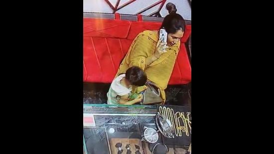 The woman was caught on camera slipping the gold chains into her bag. (HT File)