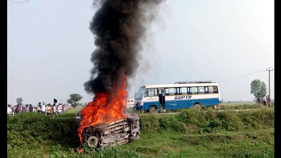 Uttar Pradesh, Oct 03 (ANI): A vehicle set ablaze after violence broke out after farmers agitating were allegedly run over by a vehicle in the convoy of a union minister, in Lakhimpur Kheri on Sunday. (ANI Photo) (Naeem Ansari)