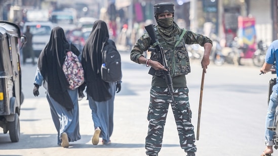 A security personnel stands guard during a surprise checking in Srinagar, Saturday, Oct. 9, 2021. Srinagar city has been put on a high alert following the recent several civilian killings. (PTI Photo/S. Irfan)(PTI) A security personnel stands guard during a surprise checking in Srinagar, Saturday, Oct. 9, 2021. Srinagar city has been put on a high alert following the recent several civilian killings. (PTI Photo/S. Irfan)(PTI)